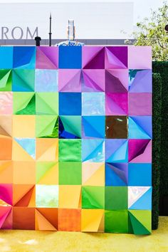 a colorful wall made out of different colored squares