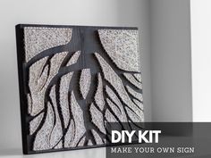 a black and white art piece with the words diy kit make your own sign