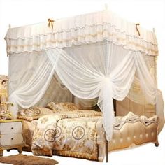 a bed with white drapes and curtains on it's headboard, sitting next to a dresser