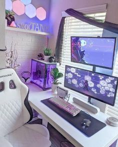 a computer desk with two monitors and a keyboard