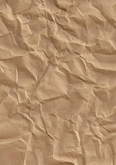 an image of wrinkled paper textured with brown color on the bottom right side and top left corner