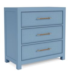 a blue dresser with three drawers and two brass pulls on the bottom, against a white background