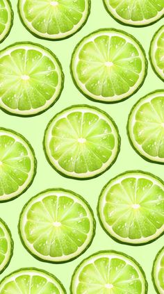 lime slices are arranged on a green background