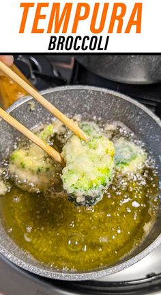 broccoli being cooked in an oil pan with chopsticks sticking out of it