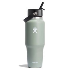 a stainless steel water bottle with a black lid and a white logo on the side