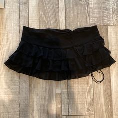 Brand New! Never Been Worn Mini Drawstring Side Tiered Hem Skirt. Purchased From Shein As A Swimsuit Cover Up For The Lake But It Was Too Big. Machine Wash Or Dry Clean. Smoke Free Home. Black Ruffled Bottoms For Vacation, Black Mini Skirt With Drawstring, Black Mini Skirt For Beach In Spring, Vacation Black Mini Skirt, Casual Mini Swim Skirt For Parties, Mini Skirt With Drawstring For Night Out, Summer Black Mini Skirt With Drawstring, Casual Black Mini Swim Skirt, Mini Bottoms With Drawstring For Night Out