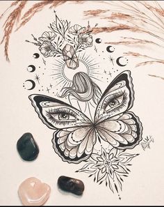 a drawing of a butterfly with eyes and flowers on its wings, surrounded by stones