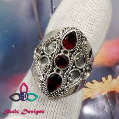 Garnet Ring, Designer Ring, 925 Sterling Silver Ring, Unique Ring, Women Gemstone Ring, Red Stone Ring, Designer Ring, Wedding Ring, Rings Gemstone - Garnet Weight- 12.1gm Stone Size- 5x7m, 5mm Metal - 925 Sterling Silver This item is made to order.  We will make the item in 3 to 5 business days after confirmation of order and will be shipped directly from India.  The pictured gemstone will not be sent, we will pick similar  gemstone to make your order. Gemstones are natural and each stone can v Elegant Red Rings With Stones, Red Stone Setting Rings For Wedding, Red Garnet Rings With Accent Stones, Red Garnet Crystal Ring With Gemstone, Red Garnet Gemstone Crystal Ring, Red Ruby Promise Ring With Stone Setting, Red Garnet Crystal Ring, Red Wedding Rings With Stone Setting, Red Garnet Stackable Rings As A Gift