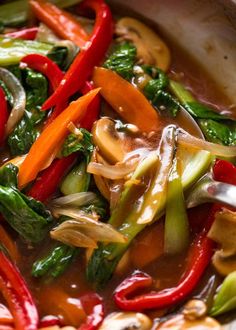 stir fry with vegetables and sauce in a pan