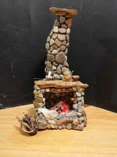 a fire place made out of rocks on a table