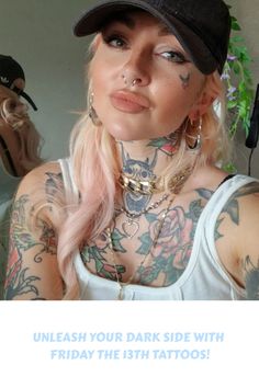 a woman with tattoos and piercings on her chest wearing a baseball cap is looking at the camera