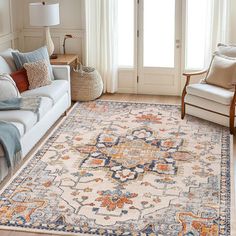 a living room filled with furniture and a large rug