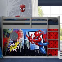 a child's bedroom with a spiderman theme on the wall and bunk bed