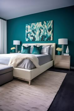 a bedroom with teal walls and white furniture in the corner, along with a large painting on the wall