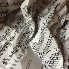 sheet music paper with musical notes printed on it, as seen from the top view