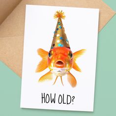 a birthday card with an image of a goldfish wearing a party hat that says how old?