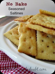 no bake seasoned saltine crackers on a white plate with red checkered table cloth