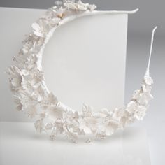 A beautifully handcrafted statement wedding headpiece. Each individual flower is painstakingly handcrafted with intricate detailing. This gorgeous bold bridal headpiece oozes femininity whilst creating a stunning statement on your wedding day.  Each flower, every tiny Pearl and crystal is individually hand wired to create this stunning heirloom bridal crown. Available in either a gold, silver or white wrapped finish. All of my pieces are individually handmade by me and can therefore be adapted t White Wedding Headpieces With Handmade Flowers, Luxury Headpiece With Handmade Flowers And Structured Crown, Formal White Handmade Flower Headpiece, Wedding Headband Porcelain Flowers, White Flower-shaped Hair Accessories With Handmade Flowers, Flower Tiara, Cherry Blossom Wedding, Headpiece Jewelry, Bride Headpiece