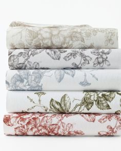 four floral sheets stacked on top of each other