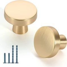 brass cabinet knobs and screws on a white background