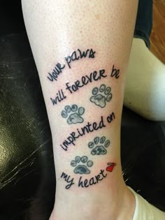 a person with a tattoo on their leg that says we paws will forever be imprinted on my heart