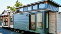 a tiny house is parked on the street