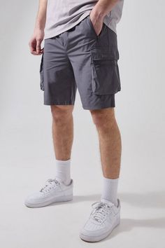 If it's comfort that you're looking for in men's holiday fashion, pick a pair of shorts from our unrivalled selection. You haven't been skipping leg day, have you? No, we know you wouldn't. All the better as you'll want to sport some of our stylish denim shorts, chino shorts, jersey shorts or cargo shorts. If you're looking for new outfit ideas for this summer, consider pairing a horizontal striped t-shirt with jean shorts or opt for a printed shirt and chino shorts for a smarter combo. Round off with a pair of sliders or loafers for extra style points. Cargo Shorts Men Outfits, New Outfit Ideas, Cargo Outfit, Plus Size Joggers, Gym Jacket, Tall Man, Gym Tees, Going Out Trousers, Plus Size Suits