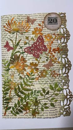 an altered photograph of flowers and butterflies on a piece of old book pages with the number twenty two