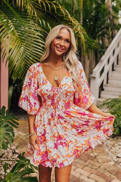 - Become a style muse with this gorgeous dress! Fully lined material - A v-cut neckline with a tie detail - Short, loose sleeves with elastic shoulders and elastic cuffs - A smocked bodice - A figure flattering silhouette that ends in a ruffled hemline Measurements S : Bust 32", Hip 36", Length 32", Sleeve Length 13.5", Waist 26-30". M : Bust 34", Hip 38", Length 33", Sleeve Length 14", Waist 28-32". L : Bust 36", Hip 40", Length 33.5", Sleeve Length 14", Waist 30-34". School Dropout, Style Muse, Loose Sleeves, Fashion School, V Cuts, Floral Mini Dress, Gorgeous Dresses, Muse, Bodice