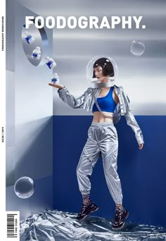 a woman in silver pants and crop top with bubbles on the cover of food photography magazine