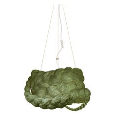 a green rope hanging from a white ceiling