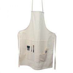 a white apron with two brushes in it