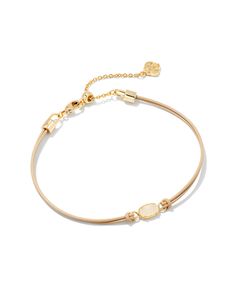 Give back in style with the Emilie Gold Corded Bracelet in Iridescent Drusy. A delicate and dainty addition to your wrist stack, this meaningful bracelet will easily become a part of your everyday layered look. Metal 14k Yellow Gold Over Brass Closure Lobster Clasp Size 6.5" Chain With 1.5" Extender, 3.5"L X 0.14"W PendantDue to the one-of-a-kind nature of the medium, exact colors and patterns may vary slightly from the image shown. | Kendra Scott Emilie Gold Corded Bracelet in Iridescent Drusy Dainty Pink Bracelet, Dainty Bracelets Gold, Wrist Stack, Icon Jewelry, Kendra Scott Bracelet, Rose Gold Pendant Necklace, Wrist Stacks, Amazon Wishlist, Solitaire Rings