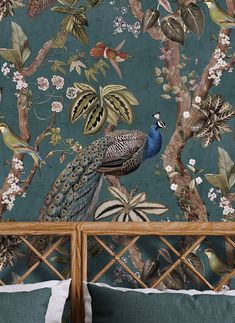 a peacock sitting on top of a wooden bed next to a wallpaper covered in leaves and flowers