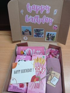 an open birthday box filled with personal items