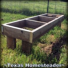 a wooden bench sitting in the middle of a field with words texas homesteader written on it