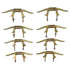 six brass - plated metal hooks with long handles