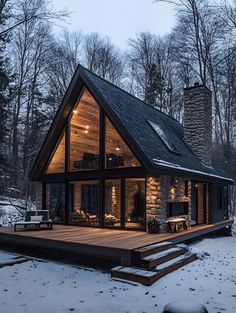 a small cabin in the woods with snow on the ground