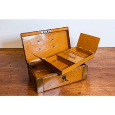 an old wooden box sitting on top of a wooden floor