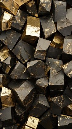 a pile of black and gold colored rocks