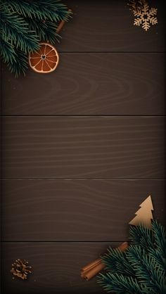 an image of christmas background with oranges and fir tree branches on wooden planks