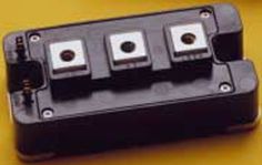 four black and white switches on a yellow surface