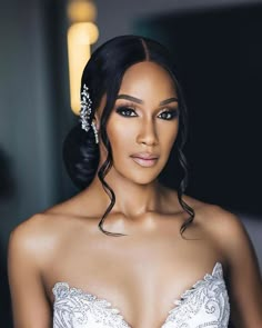 a woman wearing a wedding dress and hair comb