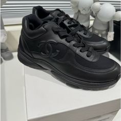 Chanel Uniform Runners/ Sneakers Brand New Black Color With Cc Logo On Side And Chanel Written In Front Of The Shoe. Size 38/8 Woman’s Jordan Shoes Men, Women Nike Shoes, New Jordans Shoes, Chanel Sneakers, Nike Shoes Air, Women Nike, Shoes Air, Nike Shoes Women, Best Sneakers