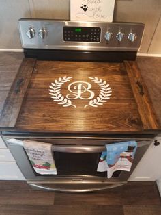 the oven is made out of wood and has an emblem on it