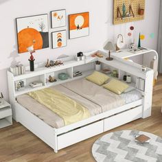 a white bed sitting on top of a wooden floor