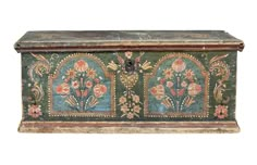 an old painted chest with flowers on it