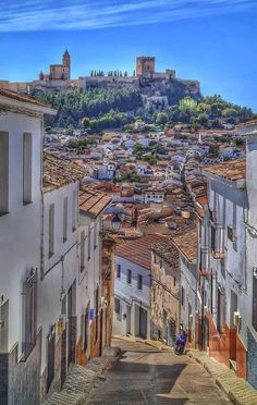 an old town with lots of buildings on the hill