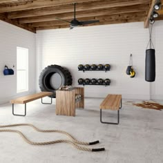 a room with white walls and wooden ceilinging has a bench in the middle, two boxing gloves hanging from hooks on the wall