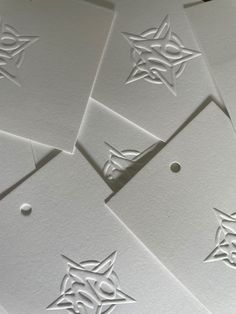 some white paper with designs on it